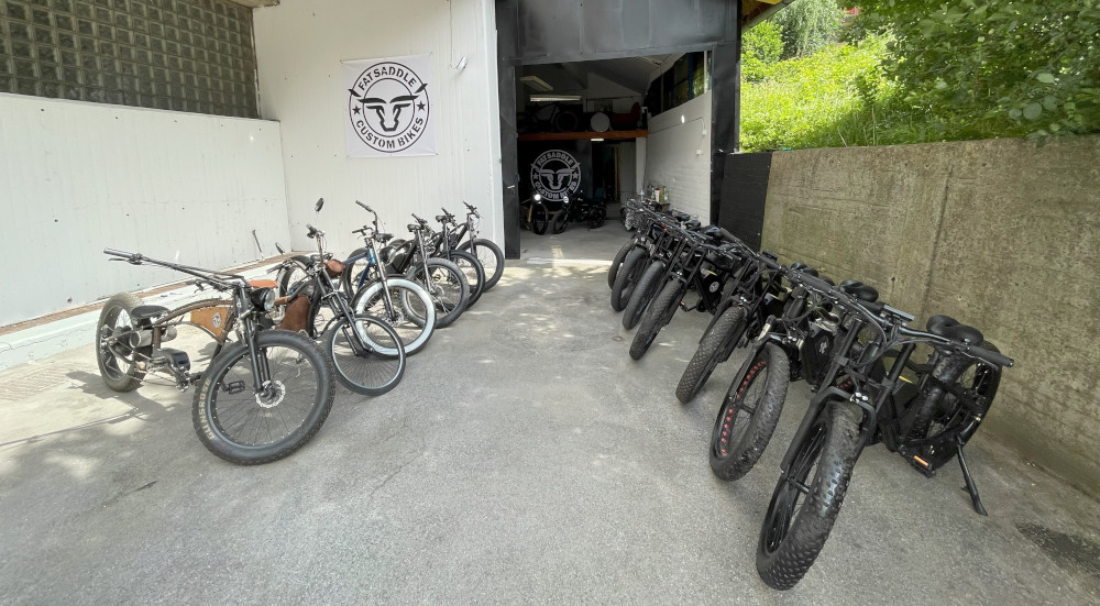 Riders on FatSaddle e-bikes with Sarajevo in the background